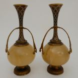 A PAIR OF ONYX AND GILDED METAL VASE GARNITURES with coloured enamel decoration, 23.5cm high (2)