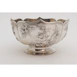 A CHINESE SILVER LOBED BOWL decorated with panels of fruit, beneath a folded rim and stamped, ZEEWO