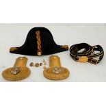 A BRITISH ROYAL NAVY BICORN HAT WITH A PAIR OF EPAULETTES by Gieve, Matthews & Seagrove, in tin