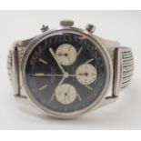 A GENTS STAINLESS STEEL BREITLING TOP TIME WATCH with black dial, three subsidiary dials and baton
