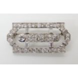 AN 18CT GOLD ART DECO STYLE DIAMOND BROOCH with Swiss hallmarks, extensively set with old cut