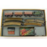 A BING MINIATURE TABLE RAILWAY SET with clockwork locomotive, three carriages, signal box and