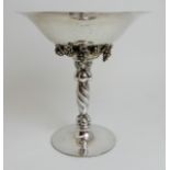 A DANISH SILVER TAZZA by Georg Jensen in the grape pattern, the circular pedestal foot with spiral