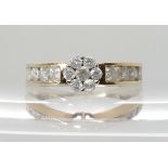 A 9CT GOLD DIAMOND FLOWER RING set with estimated approx 0.80cts of brilliant cut diamonds. Finger