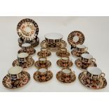 SIX ROYAL CROWN DERBY DEMITASSE CUPS AND SAUCERS pattern 1128, assorted dates, together with six