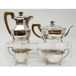 A FOUR PIECE SILVER TEA SERVICE by Emile Viner, Sheffield 1937 of rectangular form with faceted body
