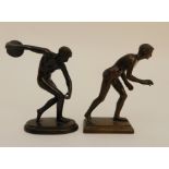 A 20TH CENTURY BRONZE CLASSICAL FIGURE OF A DISCUS THROWER upon an oval base, 16.5cm high,