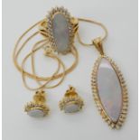 A SUITE OF ARABIC GOLD, WHITE OPAL AND CLEAR GEM SET JEWELLERY to include a ring, stamped 18k with
