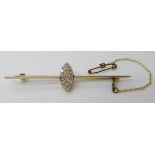A BAR BROOCH WITH A MARQUIS SHAPED DIAMOND SET CLUSTER mounted in yellow metal, the old cut