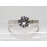 A DIAMOND SOLITAIRE RING of estimated approx 0.92cts, with a span of 0.99cts, smaller diamonds set