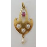 A CONTINENTAL 14K ART NOUVEAU RUBY AND PEARL PENDANT stamped 585 with a makers mark of three poppy