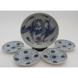 A CHINESE BLUE AND WHITE DISH painted with a dragon chasing the pearl of wisdom, 28cm diameter and