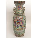A LARGE CANTON CELADON GROUND BALUSTER VASE painted with panels of mandarins and courtiers in garden