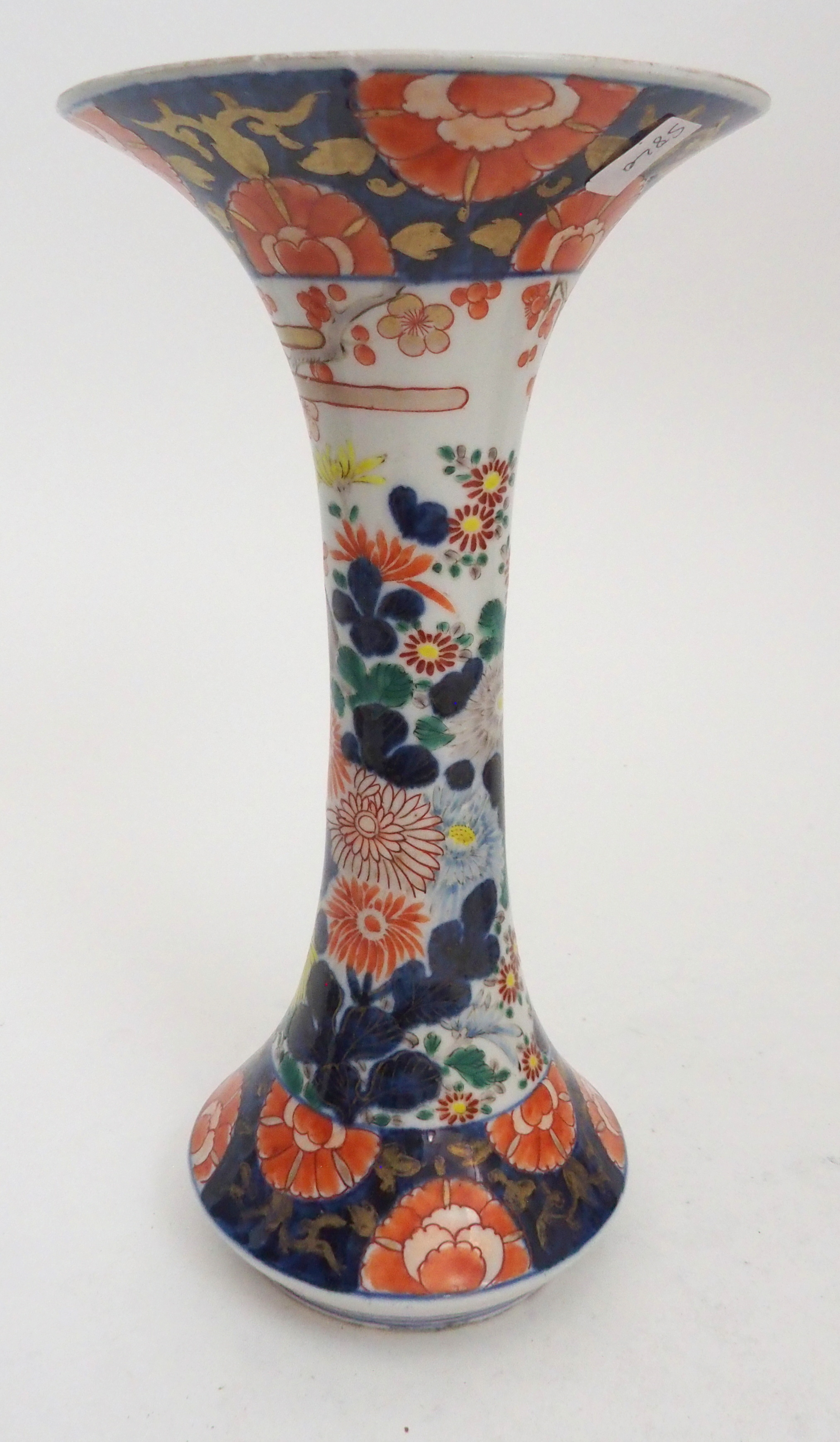 AN IMARI BOTTLE SHAPED VASE painted with figures in gardens surrounded by foliage and detailed in - Image 6 of 11