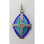 A SILVER ALEXANDER RITCHIE CROSS PENDANT with knotwork bosses, and enamelled in turquoise and