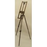 AN OAK FOLDING TRAVEL EASEL with tripod base Estate of Alasdair Gray Condition Report: Available