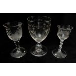 A GROUP OF THREE GLASSES comprising one Chinoiserie engraved cotton twist wine glass, 14cm high,