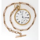 AN 18CT GOLD OPEN FACE POCKET WATCH WITH 9CT FOB CHAIN with white enamelled dial, subsidiary seconds