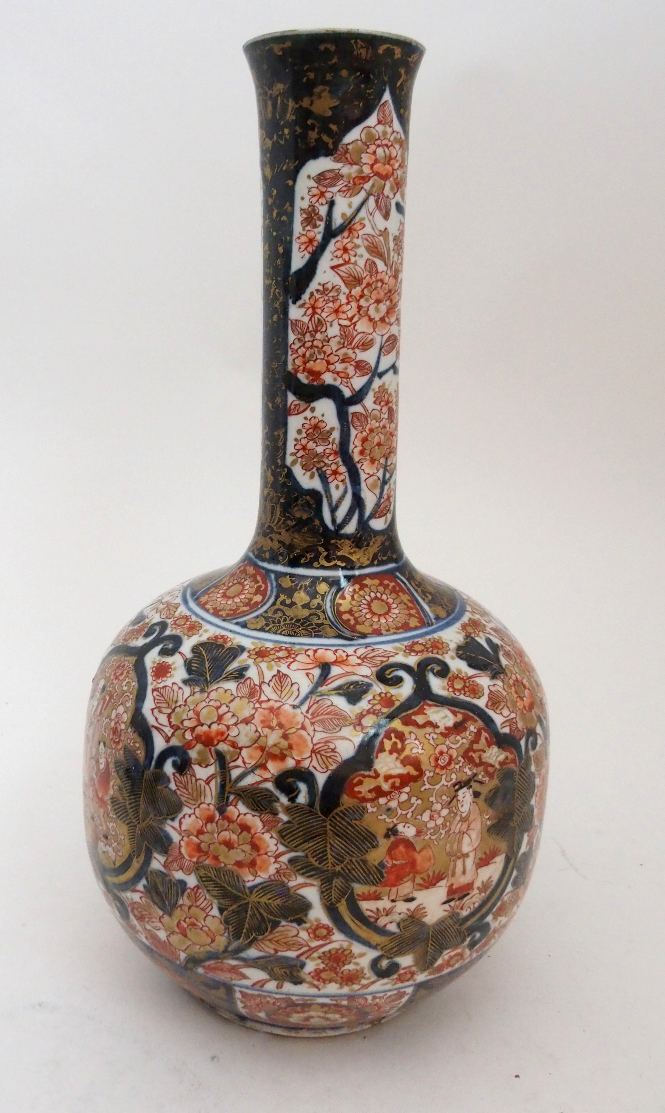 AN IMARI BOTTLE SHAPED VASE painted with figures in gardens surrounded by foliage and detailed in - Image 8 of 11