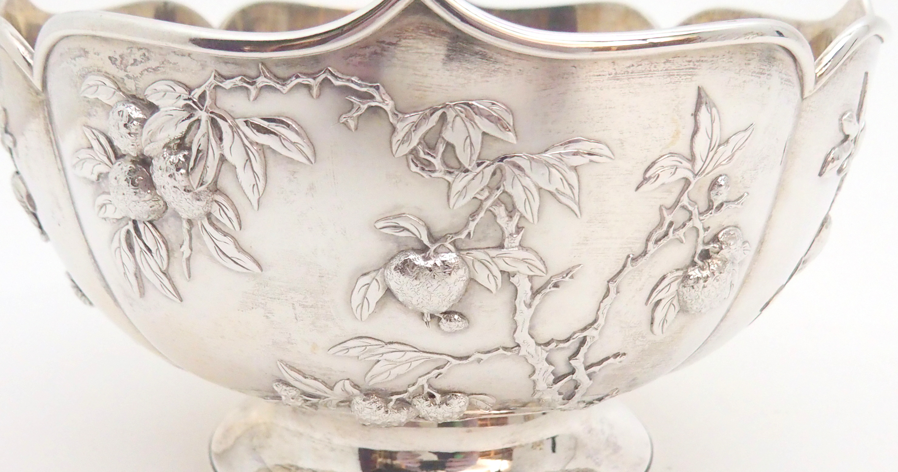 A CHINESE SILVER LOBED BOWL decorated with panels of fruit, beneath a folded rim and stamped, ZEEWO - Image 2 of 6