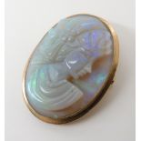 AN ITALIAN YELLOW METAL MOUNTED OPAL CAMEO PENDANT BROOCH length including bail 3.7cm x 2.2cm.