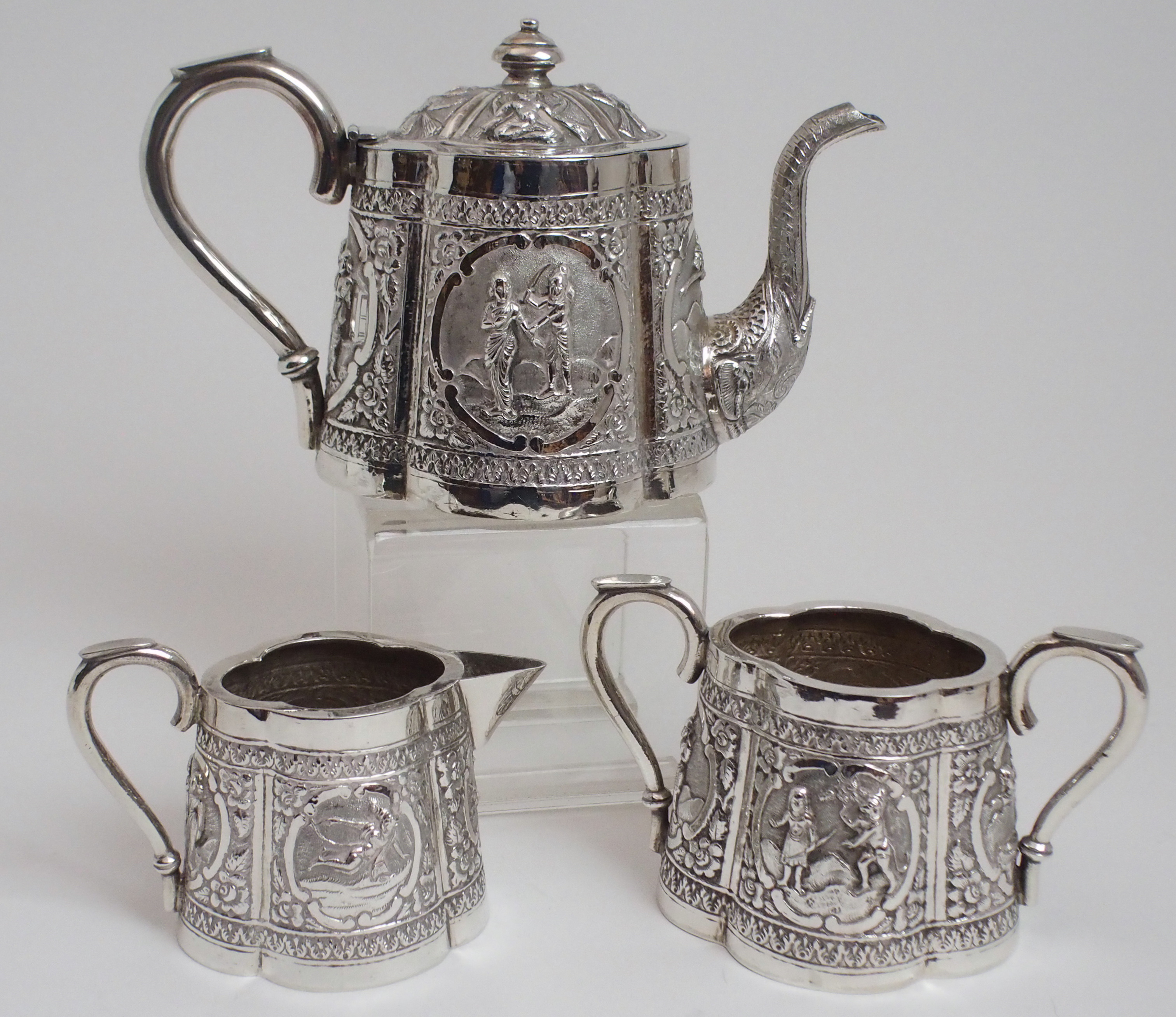 AN ASIAN WHITE METAL THREE PIECE TEA SERVICE cast and decorated with figures in cartouche panels - Image 2 of 13