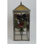 A LEADED AND STAINED GLASS HALL LIGHT of long square form, with decoration of Glasgow rose and
