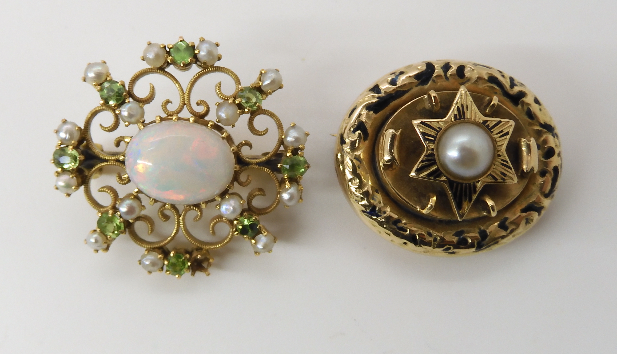 TWO VINTAGE BROOCHES a yellow metal filigree example set with a white opal, demantoid garnets and