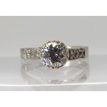 AN 18CT WHITE GOLD DIAMOND RING set with an central brilliant cut diamond of estimated approx 1ct