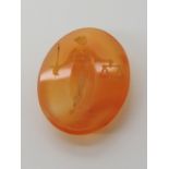 A CARVED CARNELIAN INTAGLIO depicting 'Justice', dimensions 22mm x 15mm x 3.4mm, weight 2gms