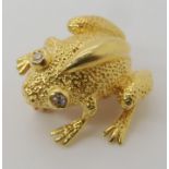 A SMALLER FROG BROOCH STAMPED TIFFANY with diamond set eyes. dimensions 2cm x 2.1cm, weight 6.8gms