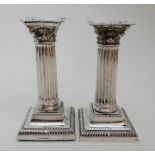 A PAIR OF SILVER CANDLESTICKS by Richard Martin and Ebenezer Hall, Sheffield 1909, the removable