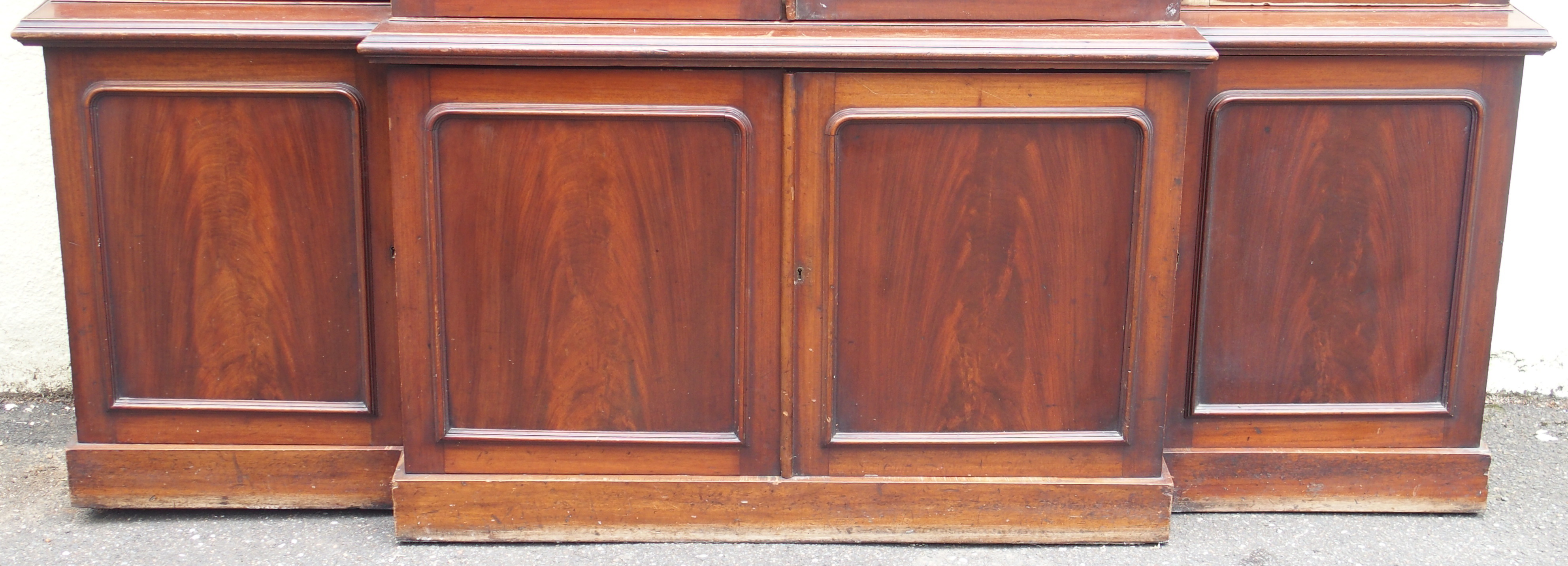 A VICTORIAN MAHOGANY BREAK FRONT BOOKCASE, with four glazed doors over a base with four doors, 231cm - Image 3 of 15