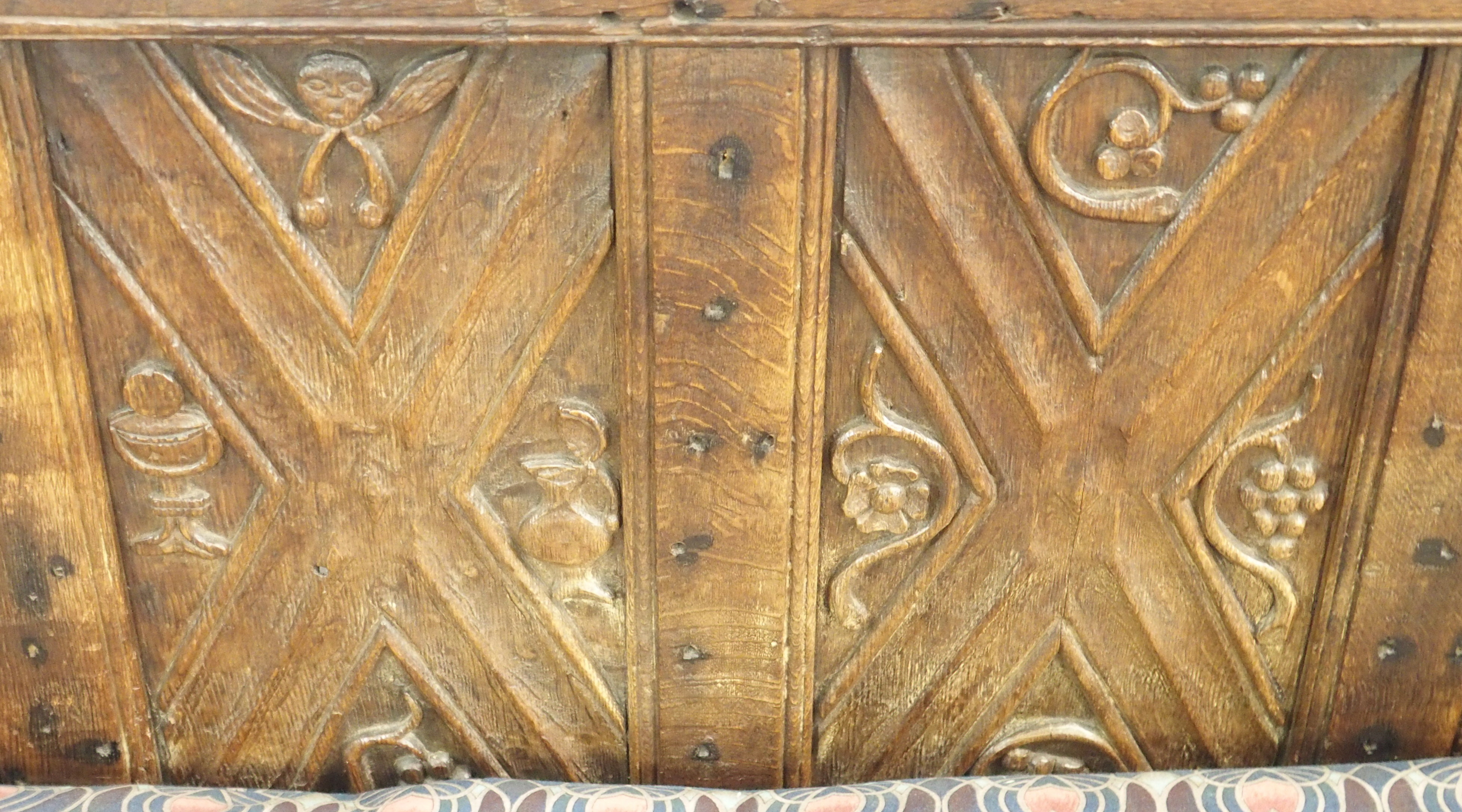A FRENCH OAK GOTHIC STYLE DAY BED the panels carved with grape vines, chalice,cup and acorns beneath - Image 7 of 14