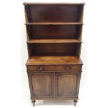 A REGENCY MAHOGANY CAMPAIGN SECRETAIRE BOOKCASE the tiered open shelves joined by brass baluster