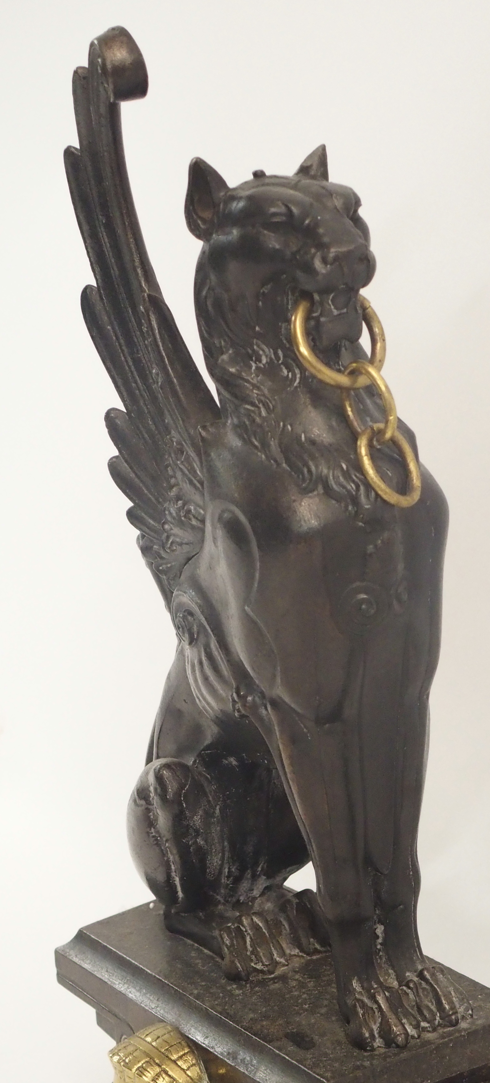 A 19TH CENTURY CAST STEEL AND BRASS FIREPLACE FENDER in three sections, modelled with winged - Image 5 of 15