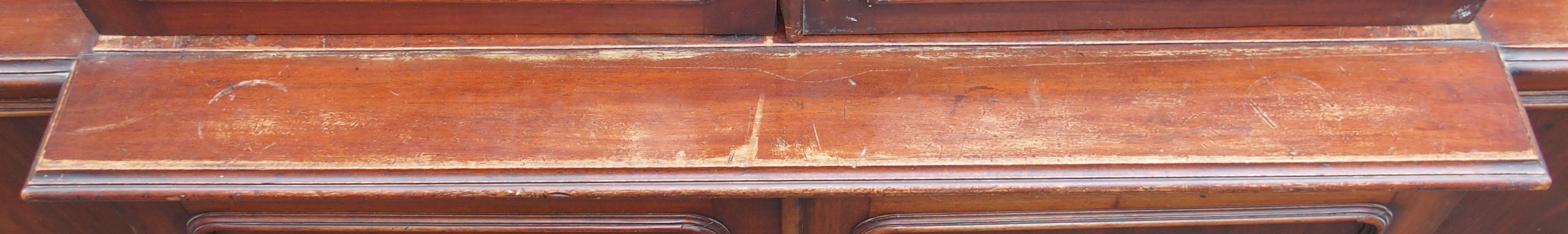 A VICTORIAN MAHOGANY BREAK FRONT BOOKCASE, with four glazed doors over a base with four doors, 231cm - Image 12 of 15