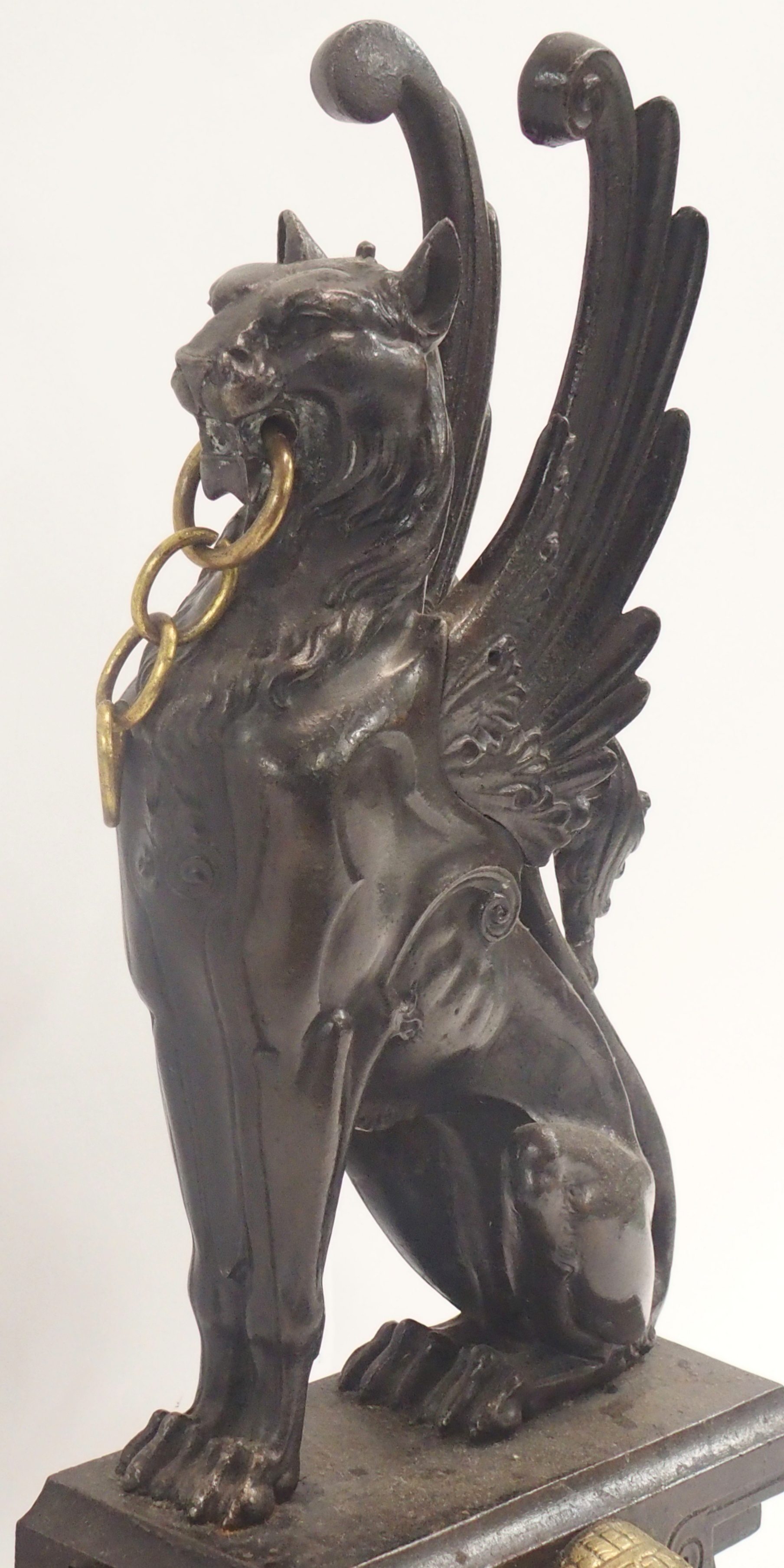 A 19TH CENTURY CAST STEEL AND BRASS FIREPLACE FENDER in three sections, modelled with winged - Image 6 of 15