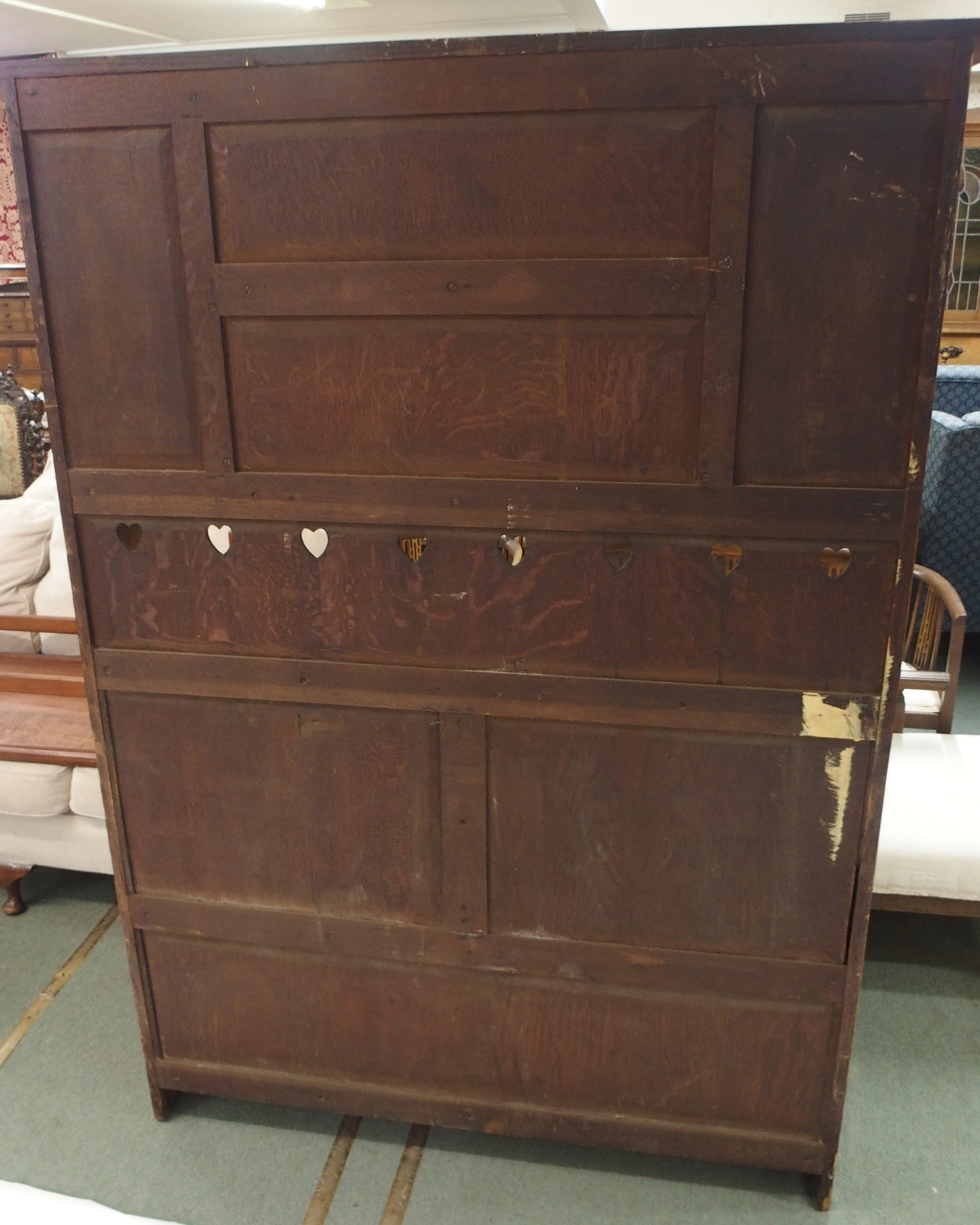 AN ARTS AND CRAFTS OAK DRESSER with open shelves, flanked by embossed inset brass panels and - Image 9 of 15