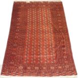 A RED GROUND TURKMEN RUG with multiple borders, 360cm x 245cm Condition Report: Available upon