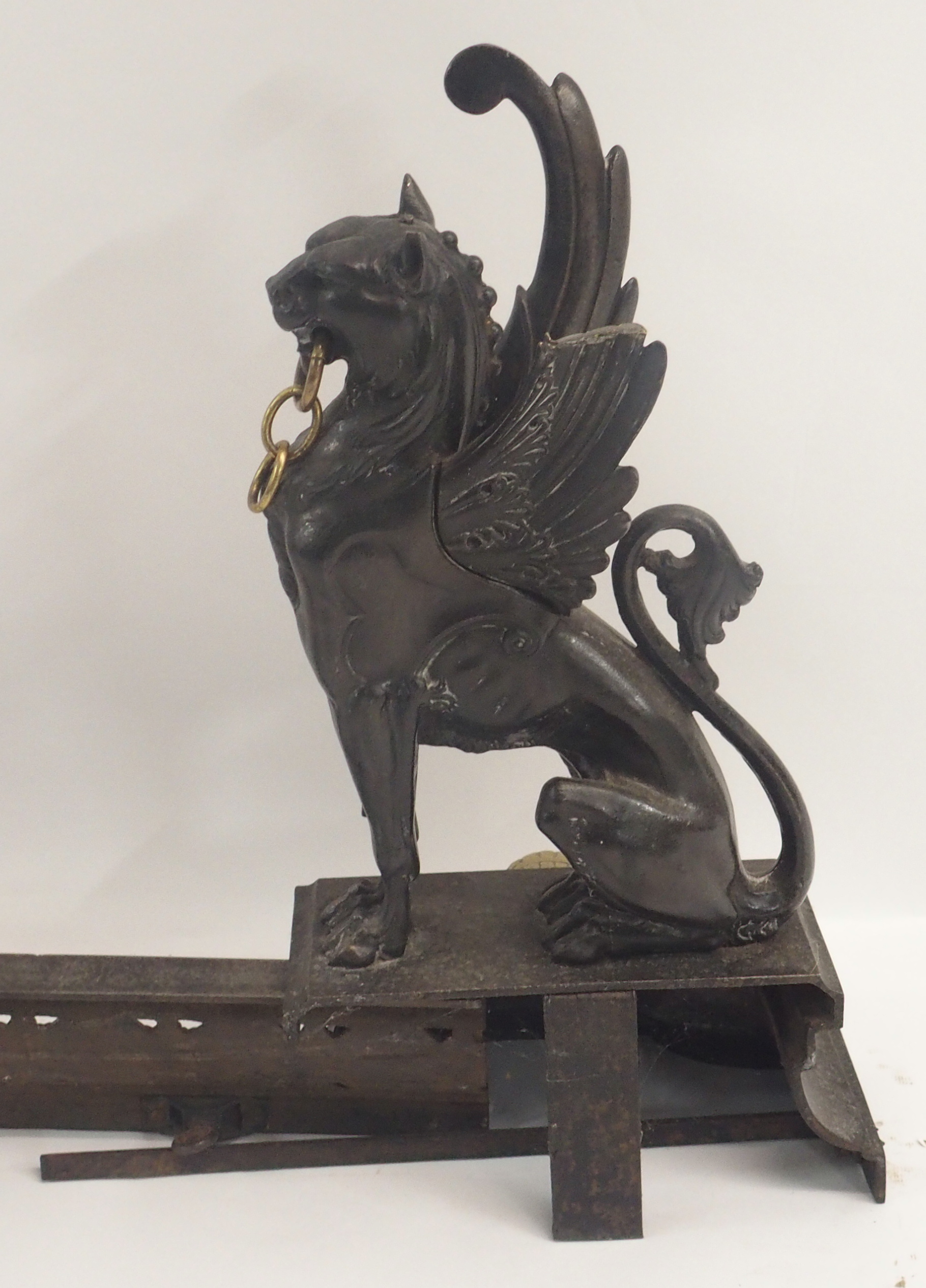 A 19TH CENTURY CAST STEEL AND BRASS FIREPLACE FENDER in three sections, modelled with winged - Image 14 of 15