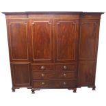 A MAHOGANY AND SATINWOOD CROSS BANDED BREAKFRONT WARDROBE the dentil cornice above a pair of central