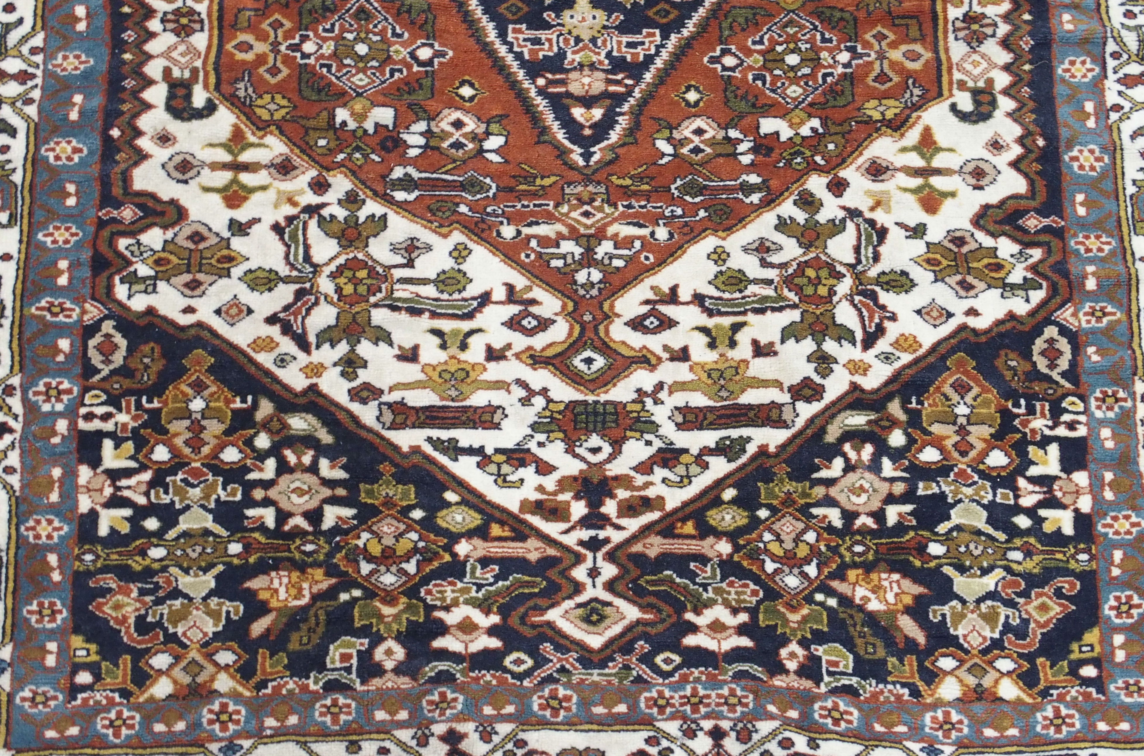 A TERRACOTTA GROUND EASTERN RUG with central medallion, 190cm x 137cm Condition Report: Available - Image 3 of 5