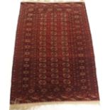 A RED GROUND TURKMEN RUG with multiple borders, 176cm x 122cm Condition Report: Available upon