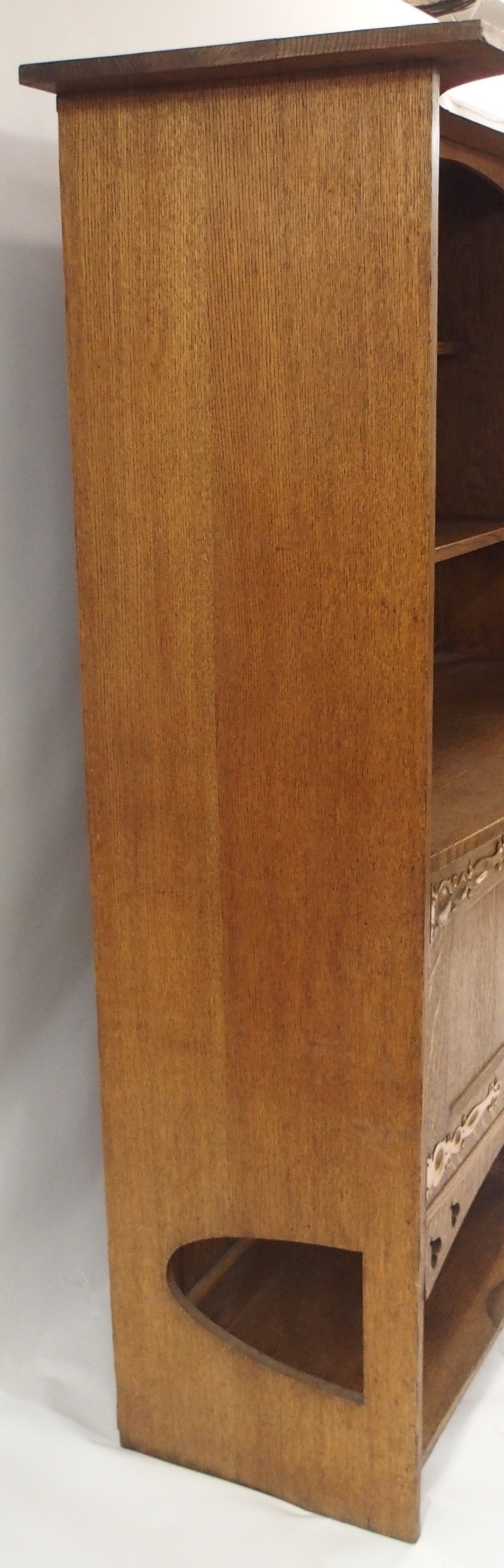 AN ARTS AND CRAFTS OAK DRESSER with open shelves, flanked by embossed inset brass panels and - Image 13 of 15