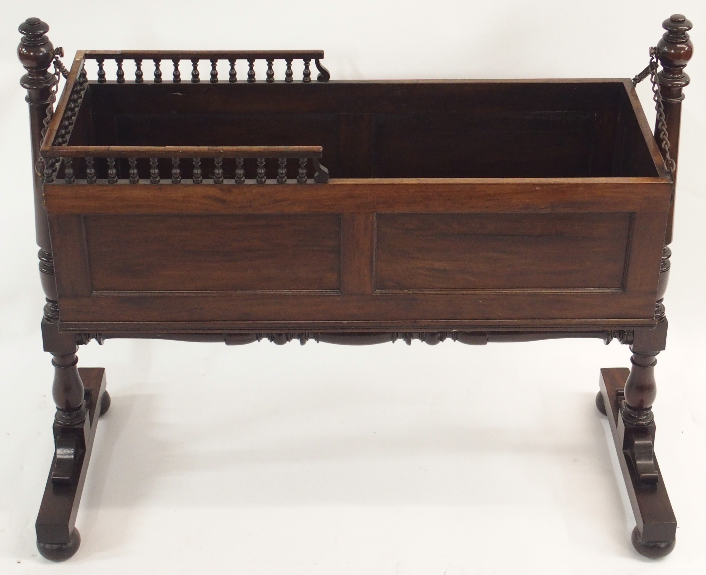 AN EARLY 19TH CENTURY MAHOGANY CRIB the panelled box with three quarter baluster gallery on chain - Image 4 of 6