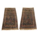 A PAIR OF INDIGO GROUND EASTERN RUGS with allover design of three trees and flowers, 251cm x