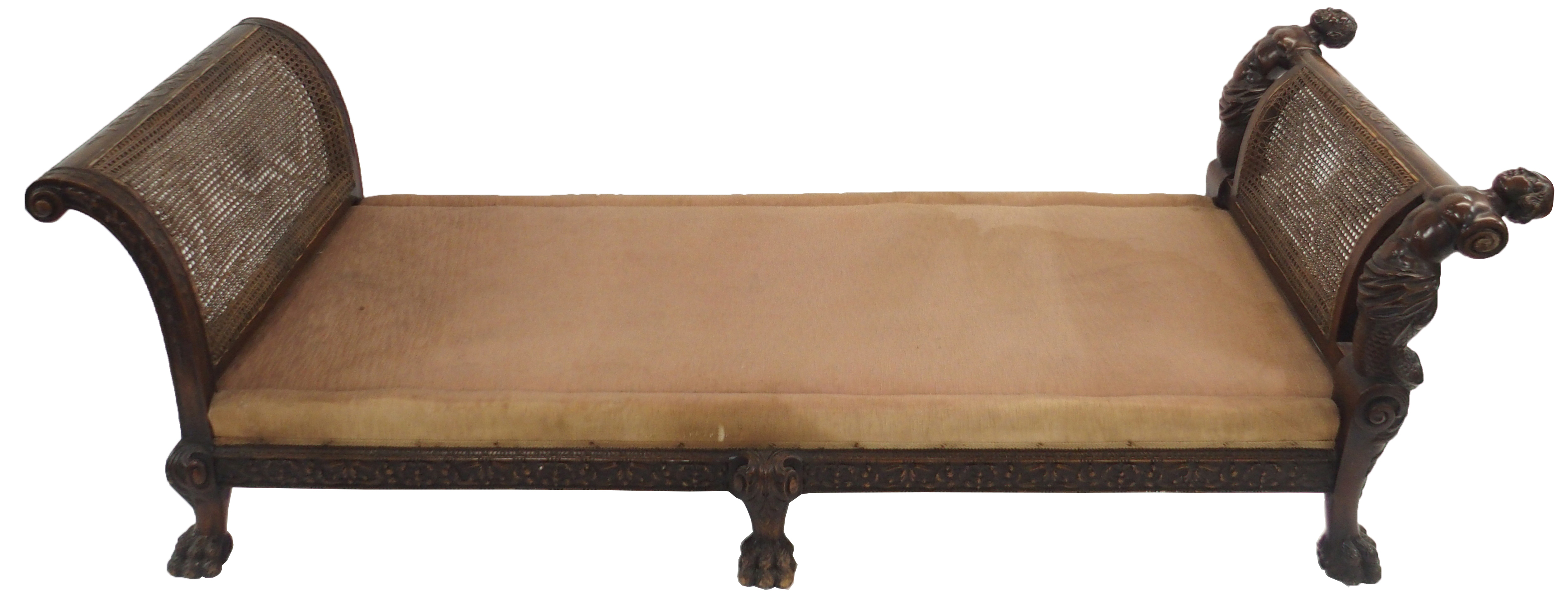 A WALNUT AND CANE FRAMED DAY BED the silk upholstered seat flanked by carved Mer figures on acanthus