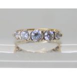 A 9ct gold five clear gem set ring size N1/2, weight 3.1gms Condition Report: Available upon