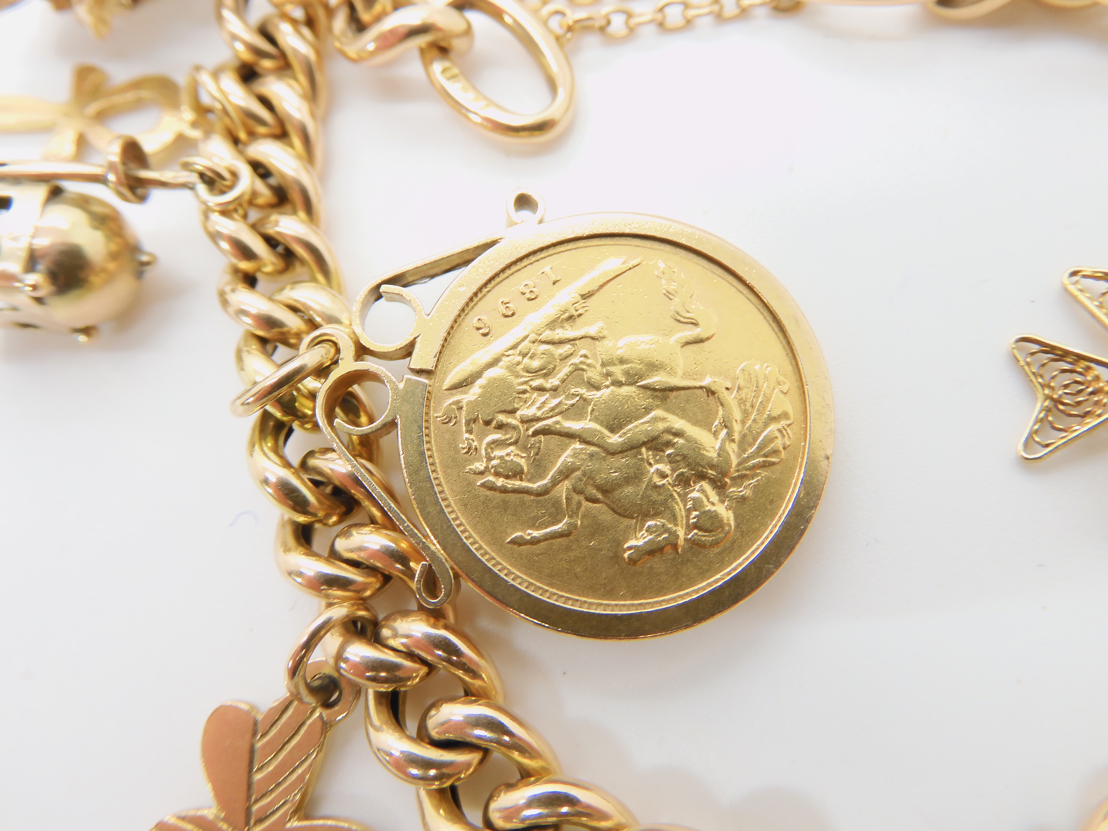 A 15ct gold curb link bracelet with heart shaped clasp, an 1896 half sovereign in 9ct pendant mount, - Image 2 of 3